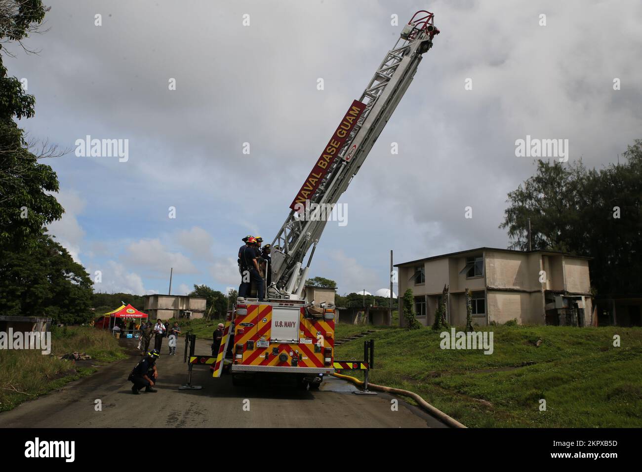 Firefighters operate a ladder truck during joint training on Marine