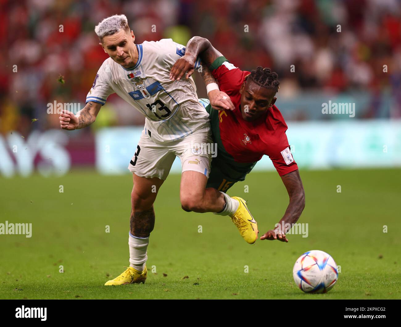 Doha, Qatar. 28th Nov, 2022. Guillermo Varela of Uruguay tussles with Rafael Leao of Portugal during the FIFA World Cup 2022 match at Lusail Stadium, Doha. Picture credit should read: David Klein/Sportimage Credit: Sportimage/Alamy Live News Stock Photo