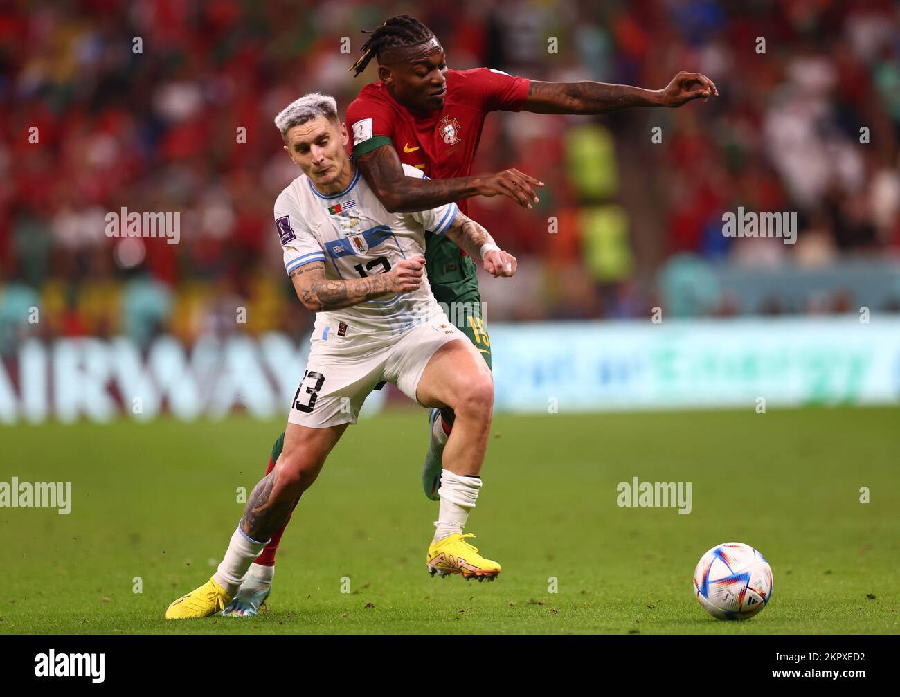 Doha, Qatar. 28th Nov, 2022. Guillermo Varela of Uruguay tussles with Rafael Leao of Portugal during the FIFA World Cup 2022 match at Lusail Stadium, Doha. Picture credit should read: David Klein/Sportimage Credit: Sportimage/Alamy Live News Stock Photo