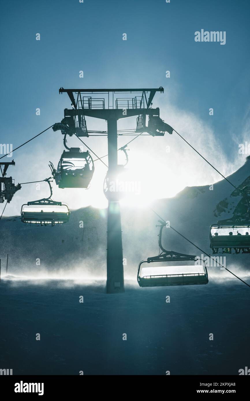 Silhouette of ski lifts in a storm, Kitzsteinhorn ski resort, Sell Am Zee, Salzburg, Austria Stock Photo