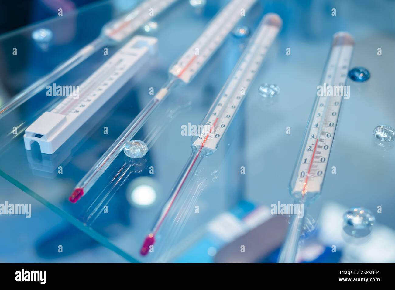 Mercury thermometers in showcase at pharmaceutical exhibition Stock