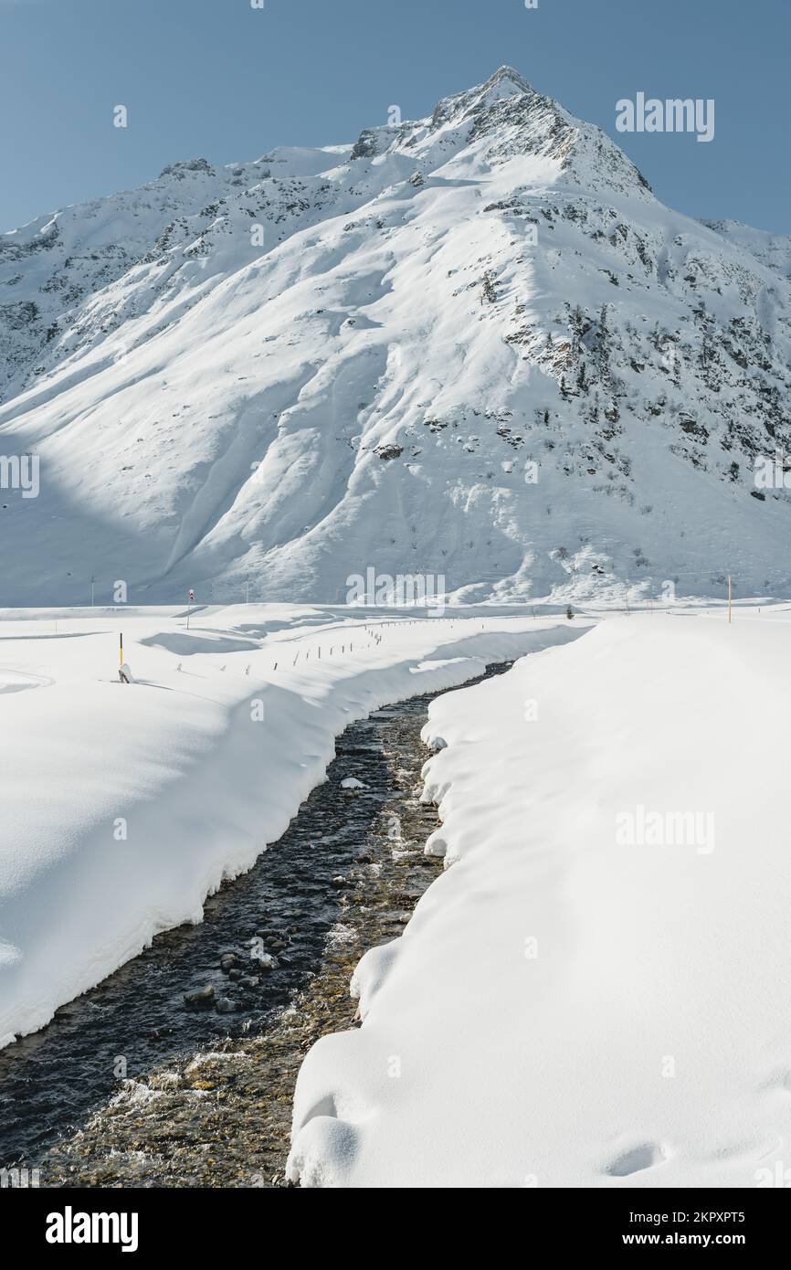 Footpath through the snow leading to a mountain in Austrian Alps, Gastein, Salzburg, Austria Stock Photo