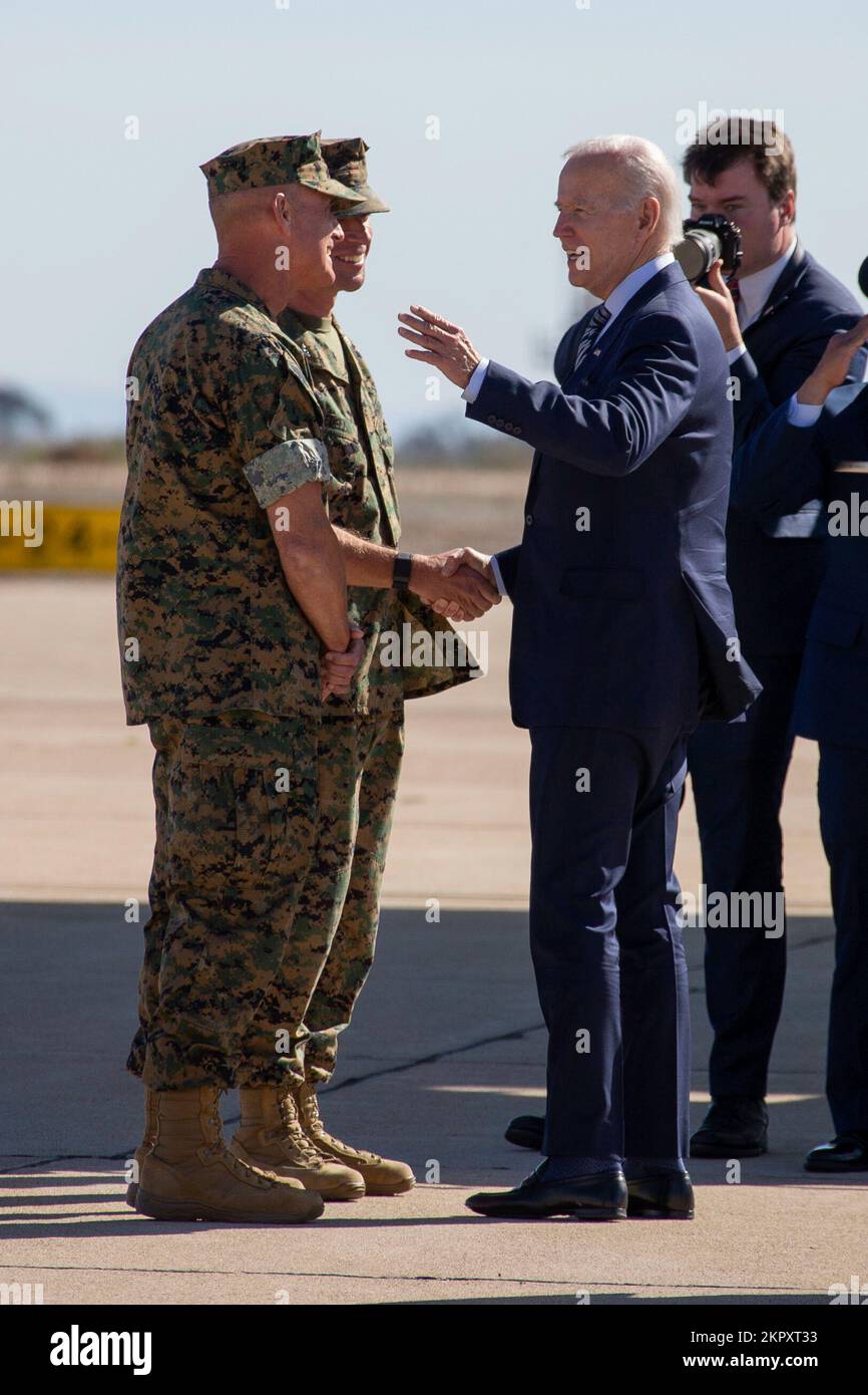 U.S. Marine Corps Maj. Gen. Bradford J. Gering, the commanding general of 3rd Marine Aircraft Wing, and U.S. Marine Corps Col. Thomas M. Bedell, the commanding officer of Marine Corps Air Station Miramar, shake hands with President Joseph R. Biden Jr. before he departs Southern California aboard Air Force One at Marine Corps Air Station Miramar, San Diego, California, Nov. 4, 2022. California,POTUS,San Diego,miramar,president, Stock Photo