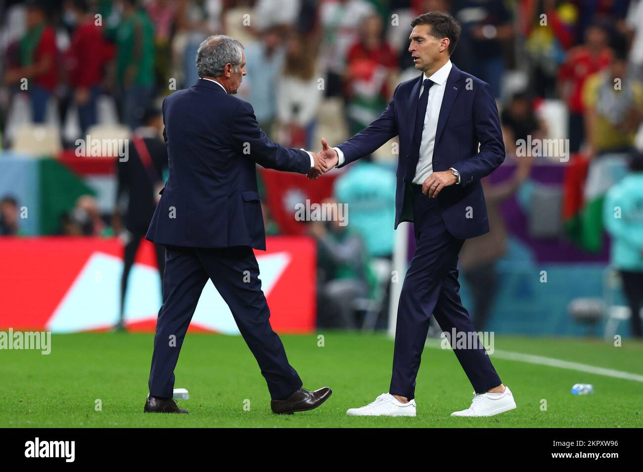 Lusail, Qatar. 28th Nov, 2022. Soccer, World Cup 2022 in Qatar, Portugal - Uruguay, Preliminary Round, Group H, Matchday 2, Lusail Stadium, Portugal's coach Fernando Santos (l) and Uruguay's coach Diego Alonso shake hands after the match. Credit: Tom Weller/dpa/Alamy Live News Stock Photo