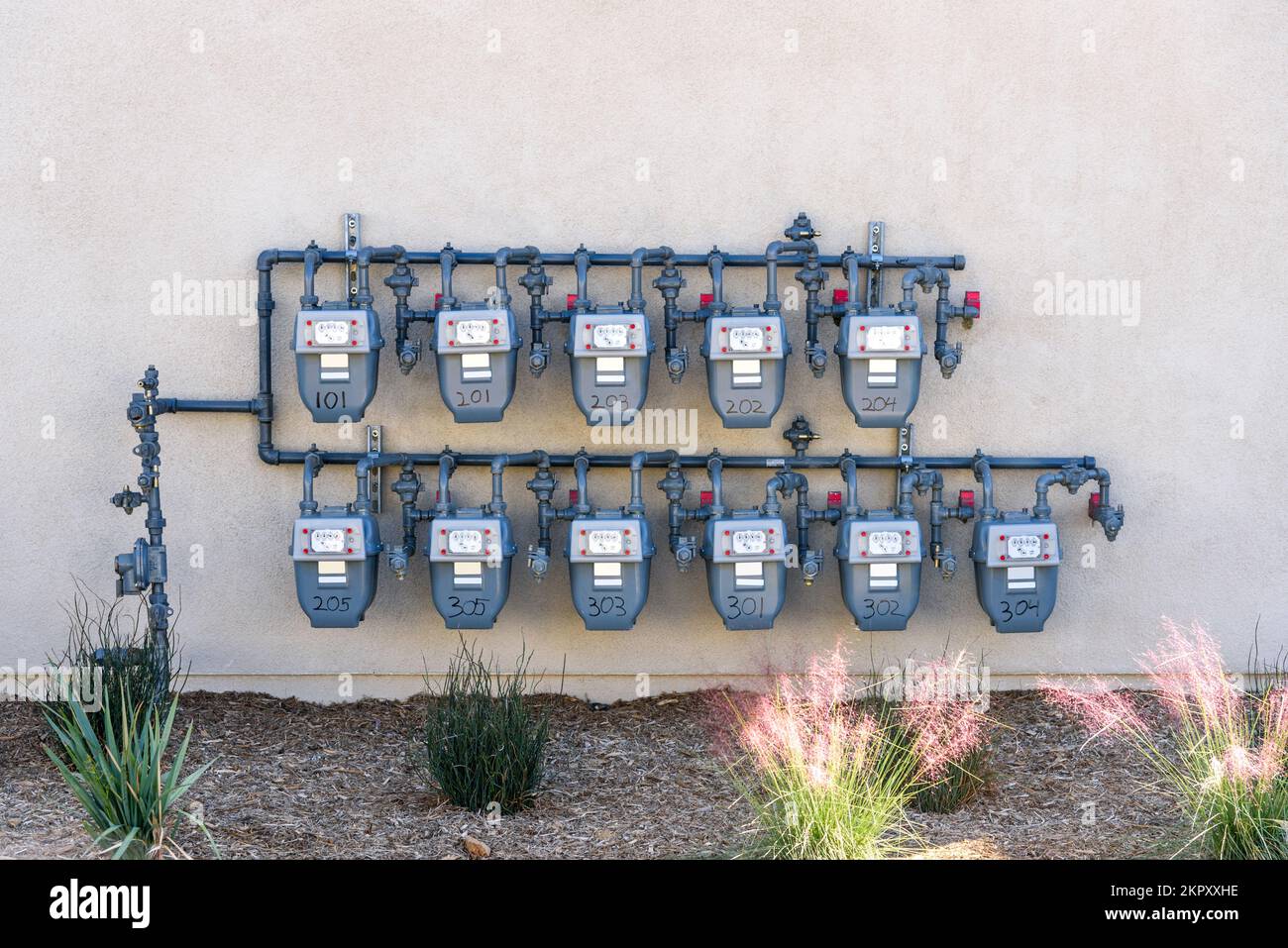 Natural gas meters on the external wall of an apartment building Stock