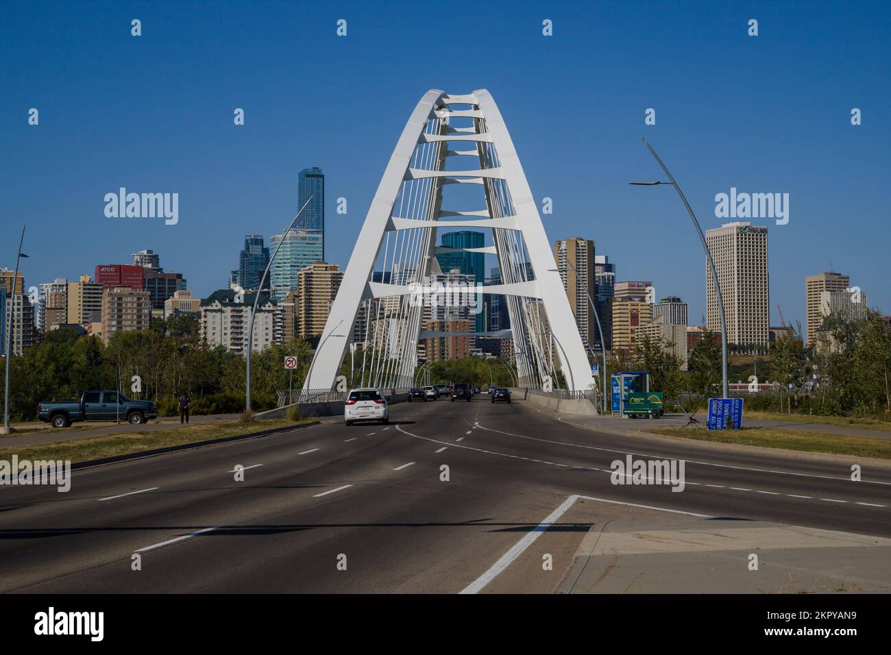 Modern arc bridge over the river, day traffic, summer time. modern architecture, panorama of the city Edmonton, Alberta, Canada Bike road Stock Photo