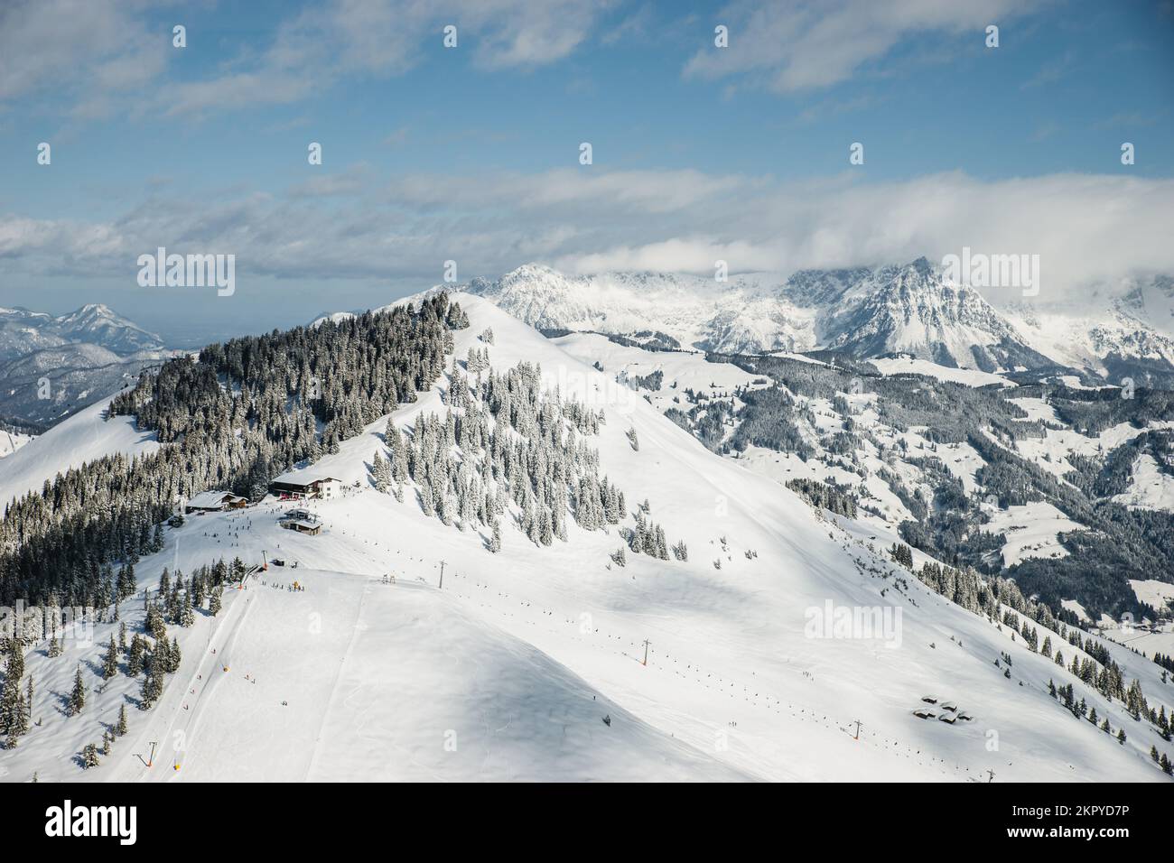 Aerial view of snowcapped mountain landscape, ski slope and ski lift, Kitzbuhel, Tyrol, Austria Stock Photo