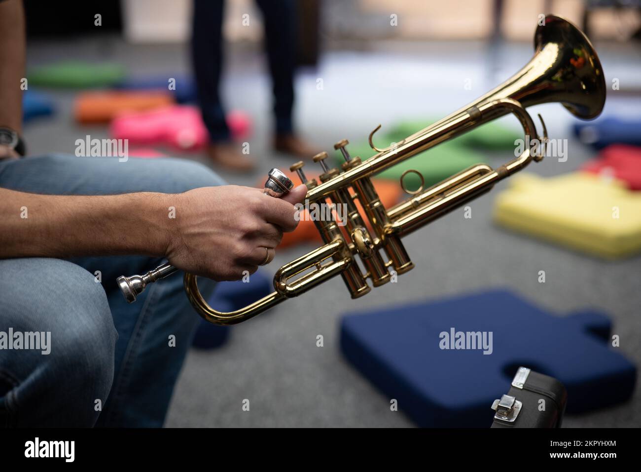 A trumpet in the hands of a musician Stock Photo Alamy