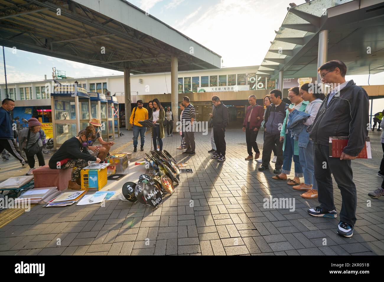 HONG KONG - CIRCA DECEMBER, 2019: painted vinyl records on display at Tsim Sha Tsui Star Ferry Bus Terminus in Hong Kong. Stock Photo