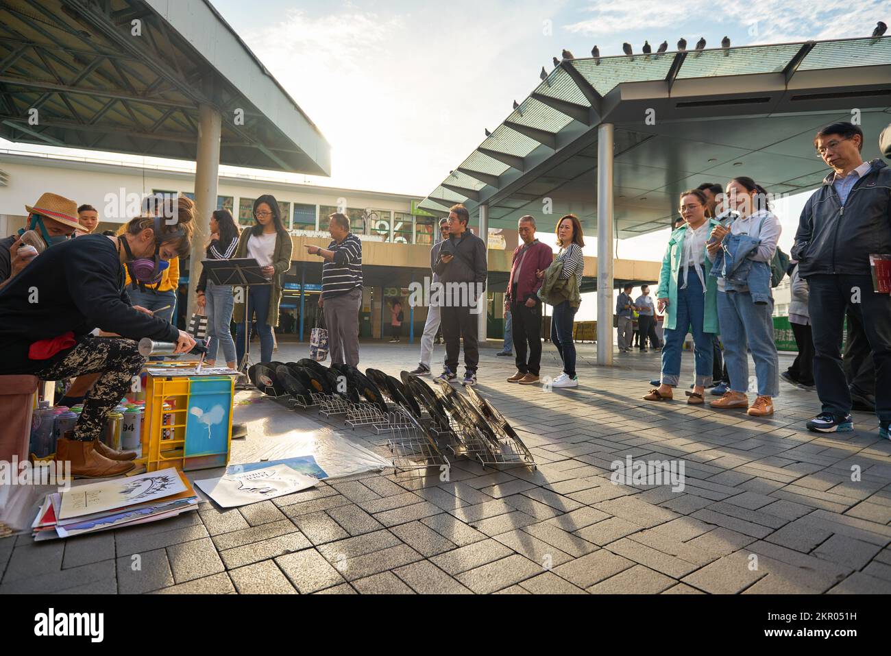 HONG KONG - CIRCA DECEMBER, 2019: painted vinyl records on display at Tsim Sha Tsui Star Ferry Bus Terminus in Hong Kong. Stock Photo