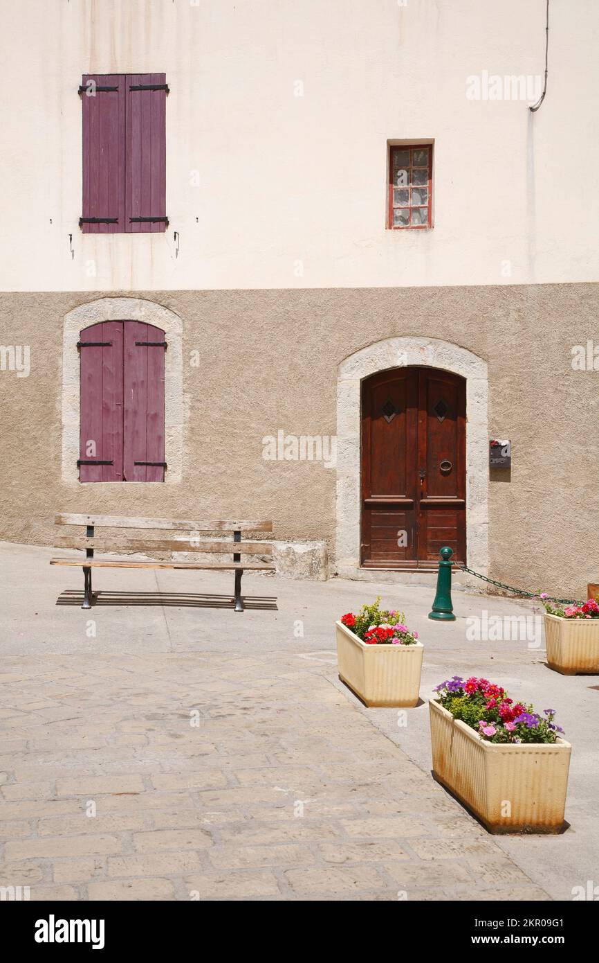 Traditional village square or town square with shuttered windows. Entrevaux, Alpes-de-Haute-Provence, France Stock Photo