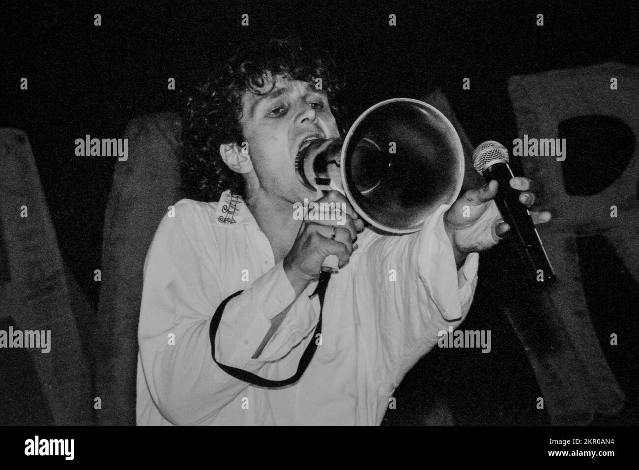 James live in concert in the 1990s - Tim Booth, singer of James, the 1990s phenomenon, on stage at Tamaris Rock Festival in 1992, holding a megaphone Stock Photo