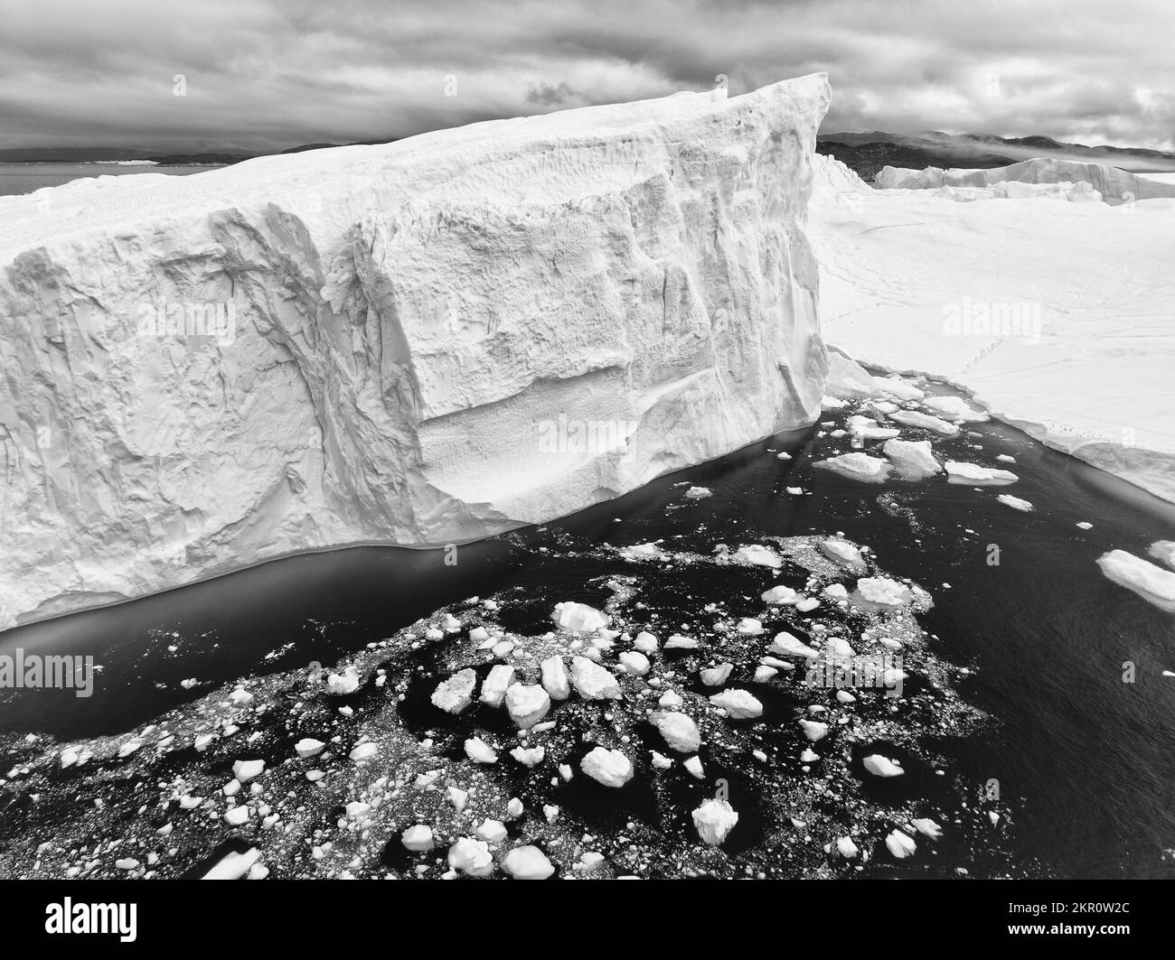 detail of extreme icebergs from aerial view in black and white Stock