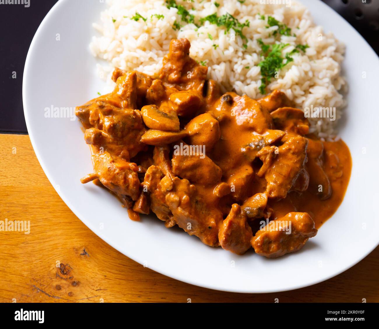 Beef stroganoff with rice Stock Photo - Alamy