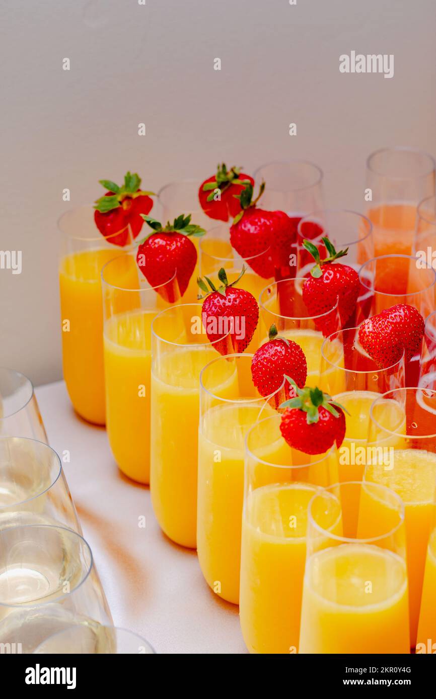 Assorted Mimosa Bar with Strawberry Garnish Stock Photo Alamy