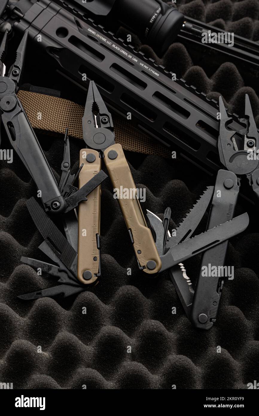 Modern multitool with many tools. A portable multi-tasking military ...