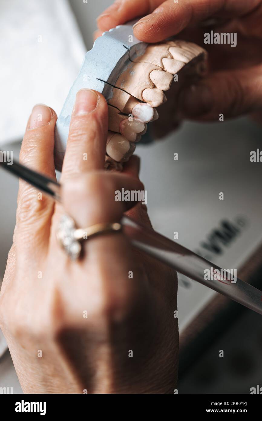 Dental technician modelling ceramic teeth crown Stock Photo Alamy
