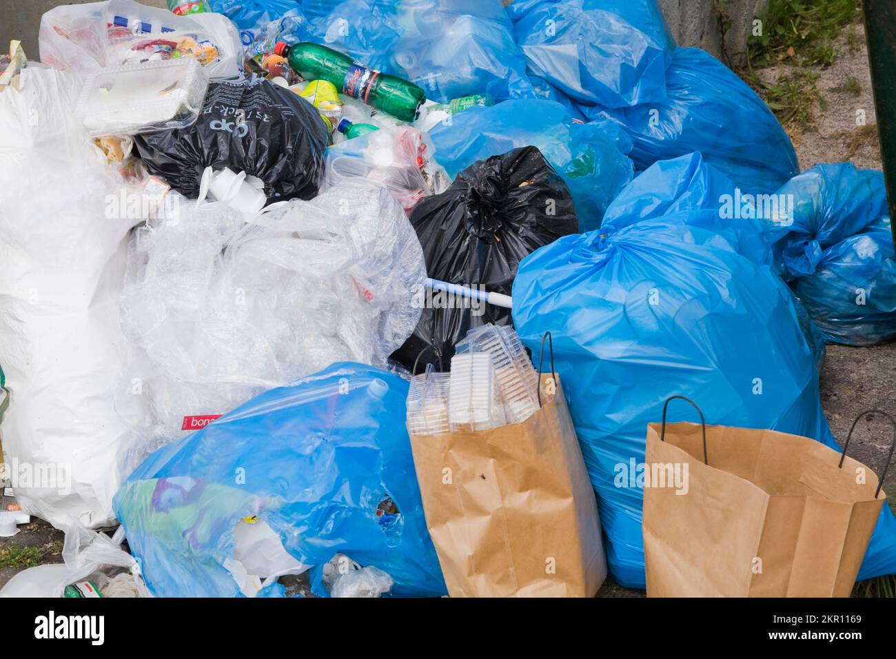 Pile of garbage bags left behind a commercial building, Donovaly village, Slovakia. Stock Photo