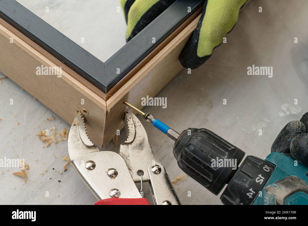 Drilling a hole in the door frame for a corner connection, installation of interior doors Stock
