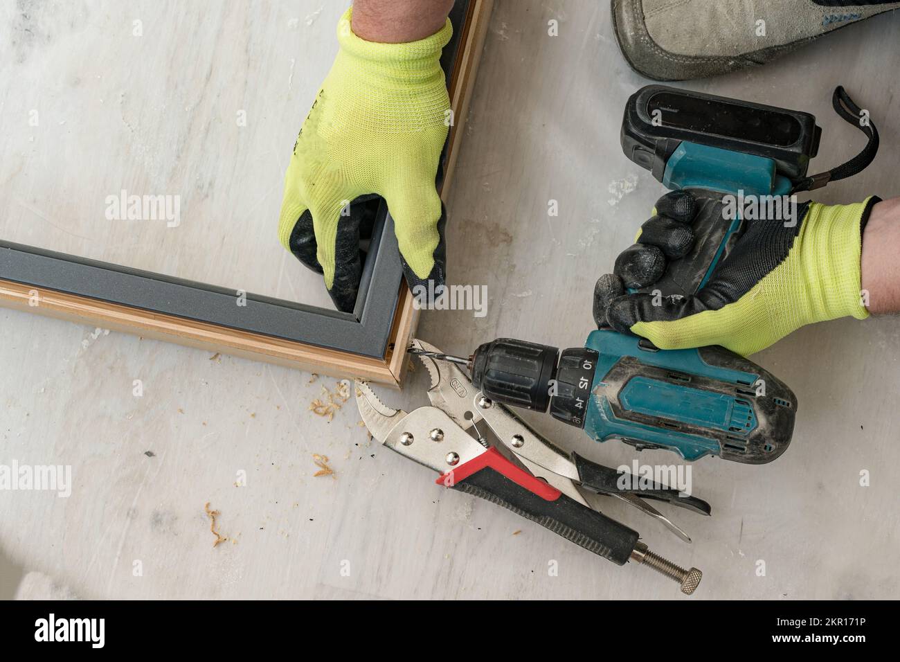 Drilling a hole in the door frame for a corner connection, installation of interior doors Stock