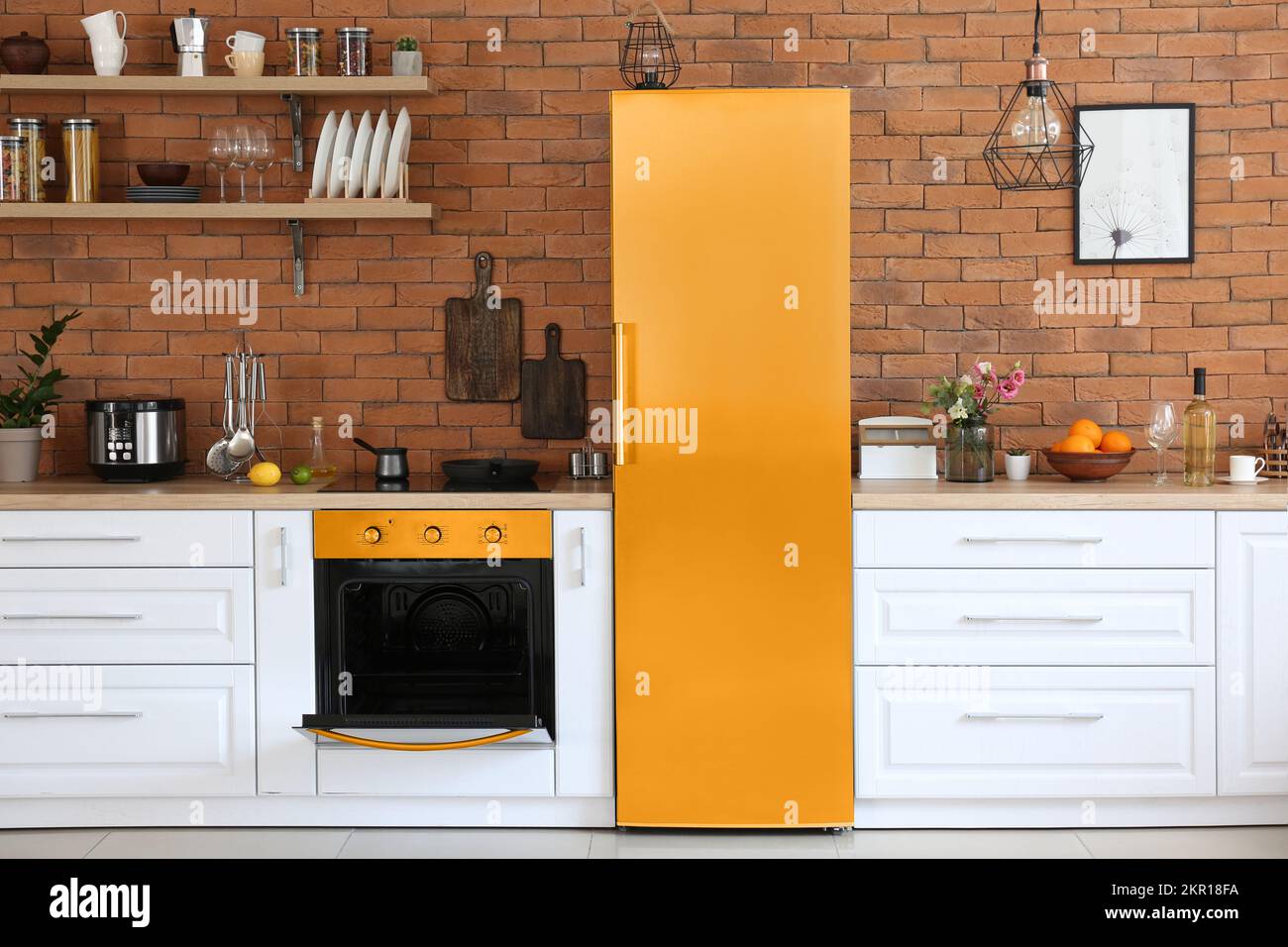 Interior of modern stylish kitchen with yellow fridge and oven Stock ...