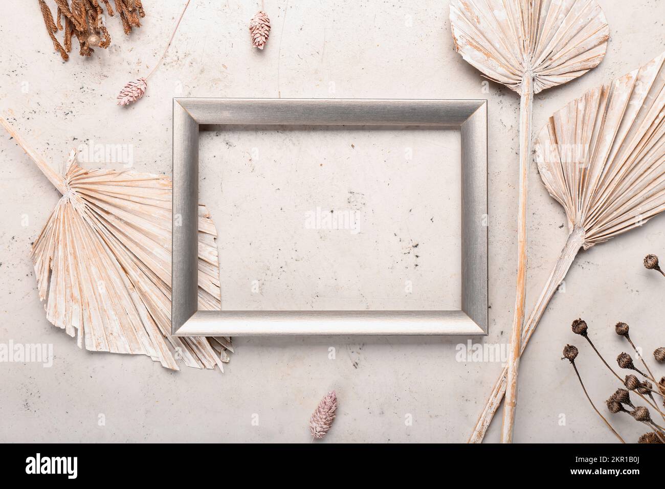 Frame with dried leaves and flowers on white background Stock Photo - Alamy