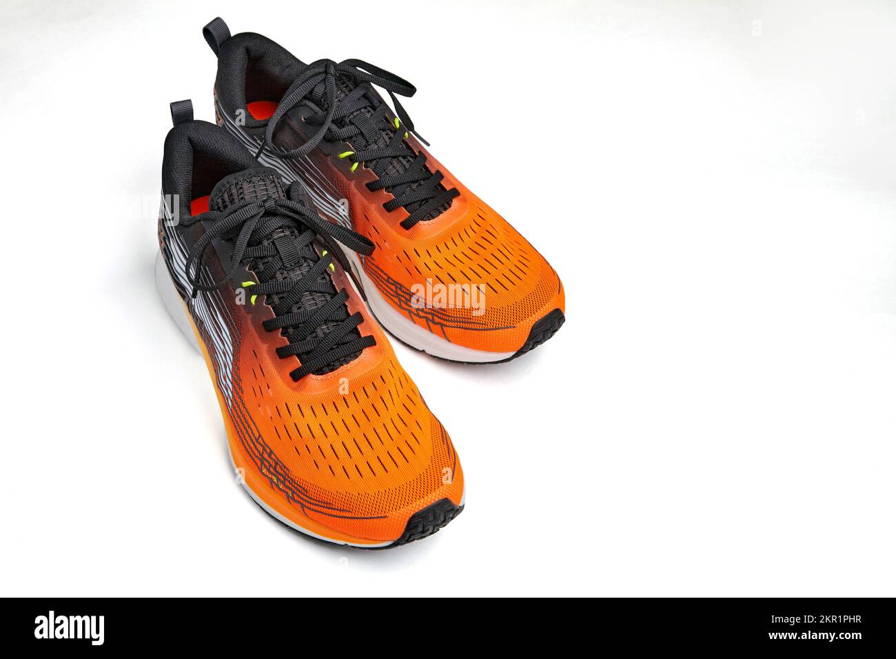 Orange sneakers on isolated on white background with copy space ...