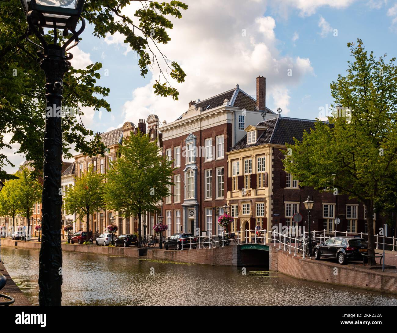 Waterways and street with historic houses in the center of the Dutch