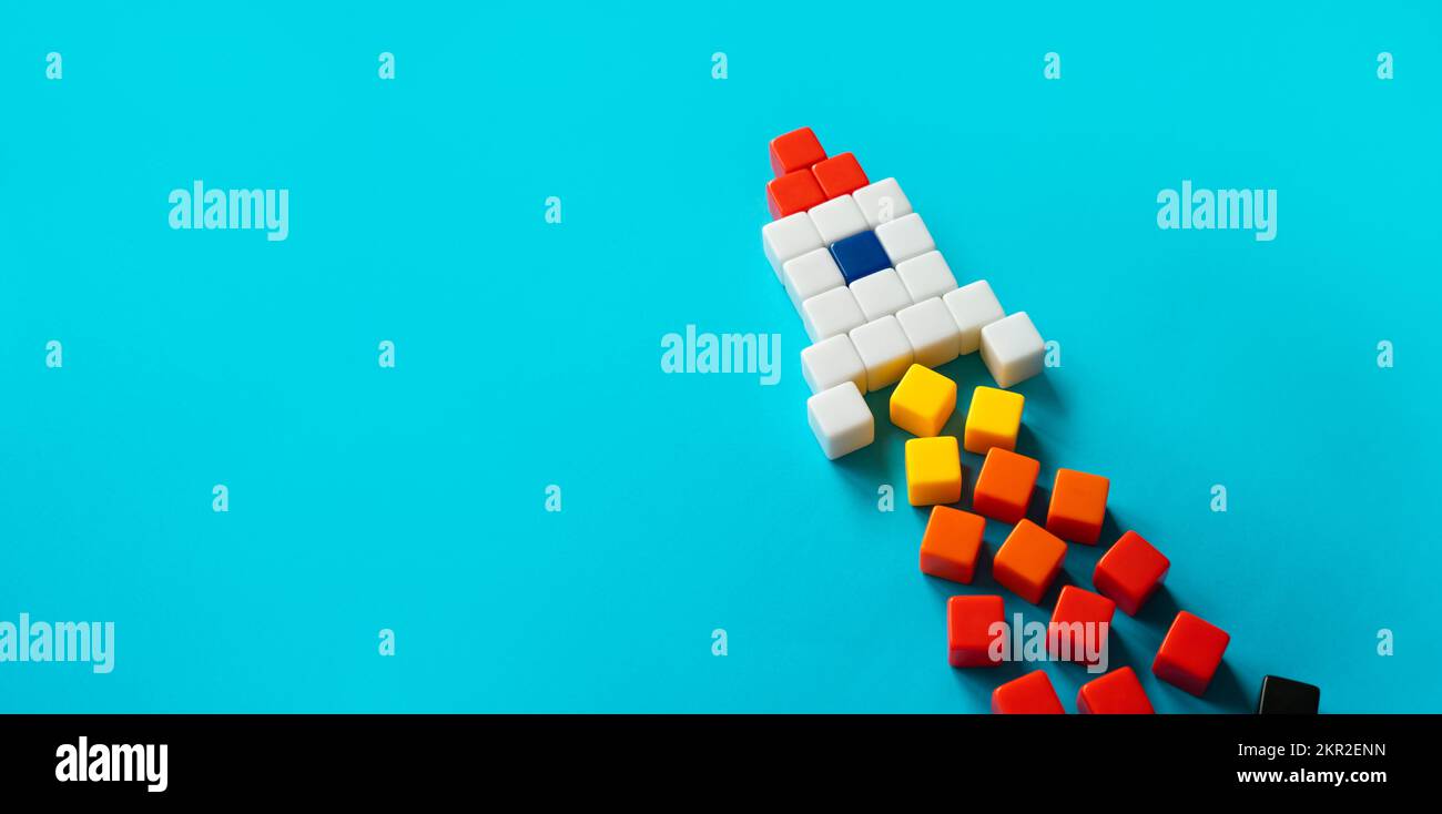 Startup rocket from blocks in launch. Concept of a successful start of a business project. Entrepreneurship. Investments in the development of high-te Stock Photo