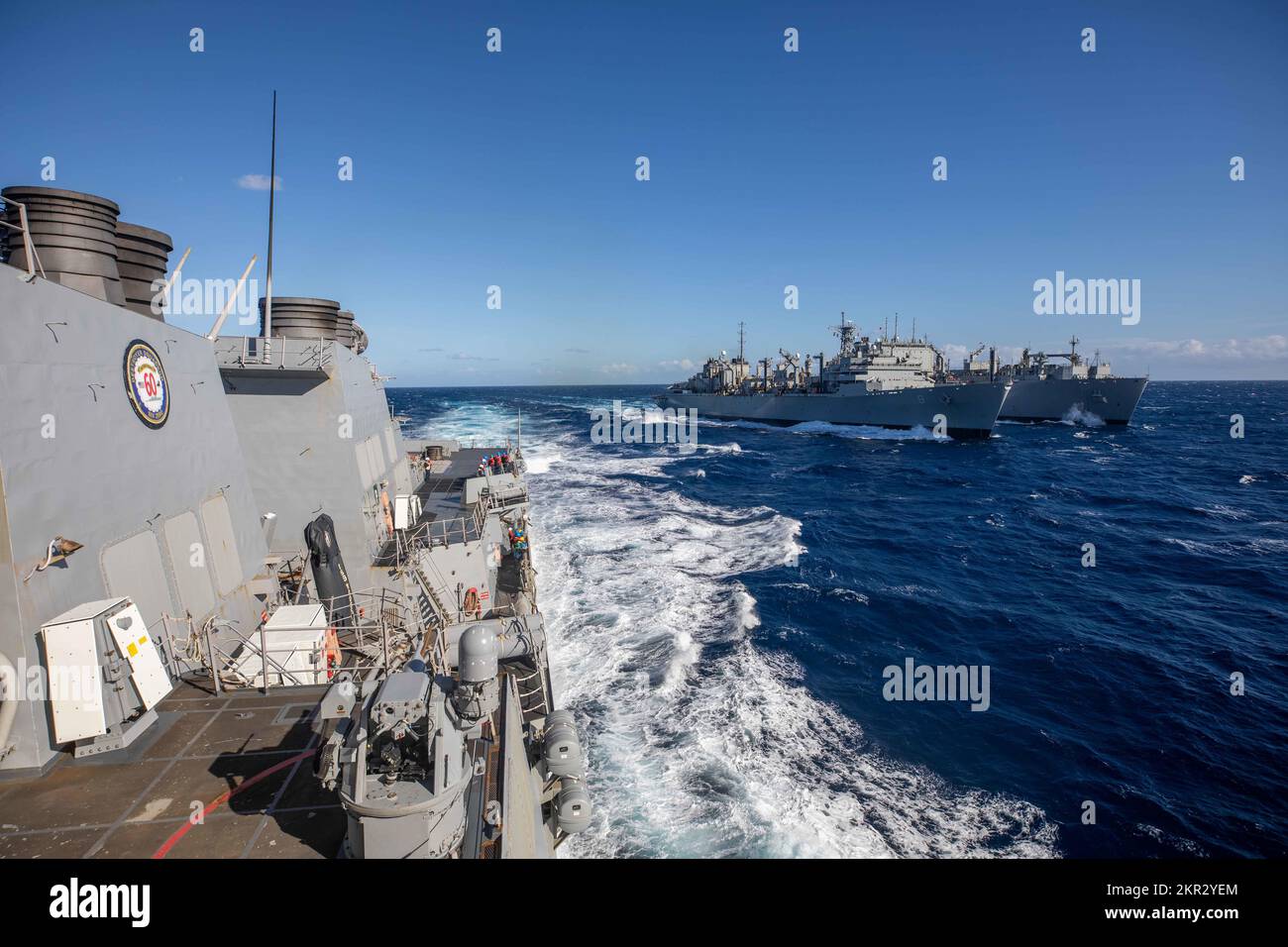 IONIAN SEA (Nov. 22, 2022) The Arleigh Burke-class guided-missile destroyer USS Roosevelt (DDG 80), left, breaks away from the fast combat support ship USNS Arctic (T-AOE 8), middle, and the Lewis and Clark-class dry cargo and ammunition ship USNS William McLean (T-AKE 12), right, after completing a replenishment-at-sea, Nov. 22, 2022. Roosevelt is on a scheduled deployment in the U.S. Naval Forces Europe area of operations, employed by U.S. Sixth Fleet to defend U.S., allied and partner interests. (U.S. Navy photo by Mass Communication Specialist 2nd Class Danielle Baker/Released) Stock Photo