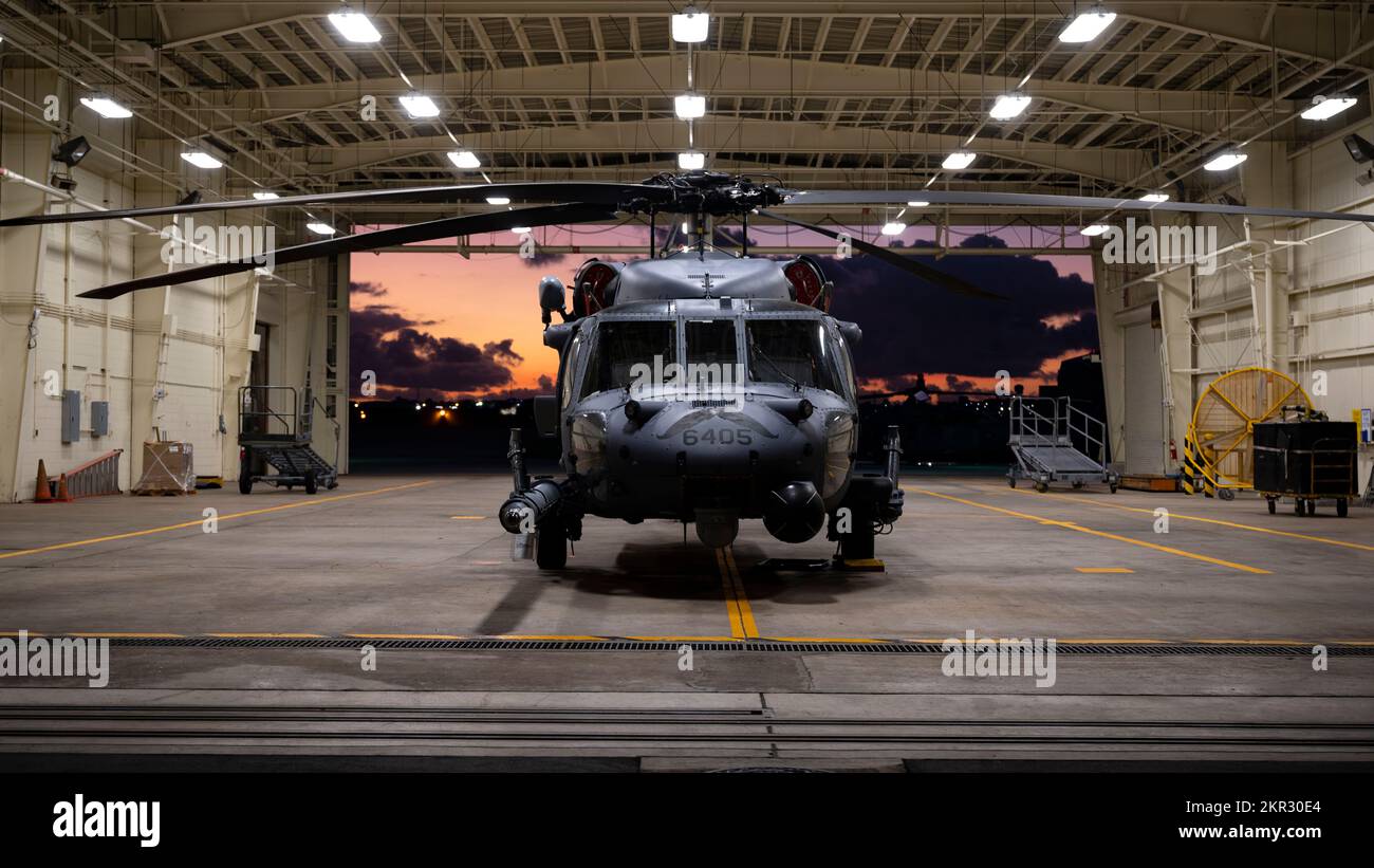 An HH-60G Pave Hawk assigned to the 33rd Rescue Squadron is parked in a hangar at Kadena Air Base, Japan, Nov. 22, 2022. The 33rd RQS maintains readiness for mobilization, deployment and employment of helicopters and rescue of U.S. and allied military members, and civilian personnel. (U.S. Air Force photo by Senior Airman Jessi Roth) Stock Photo