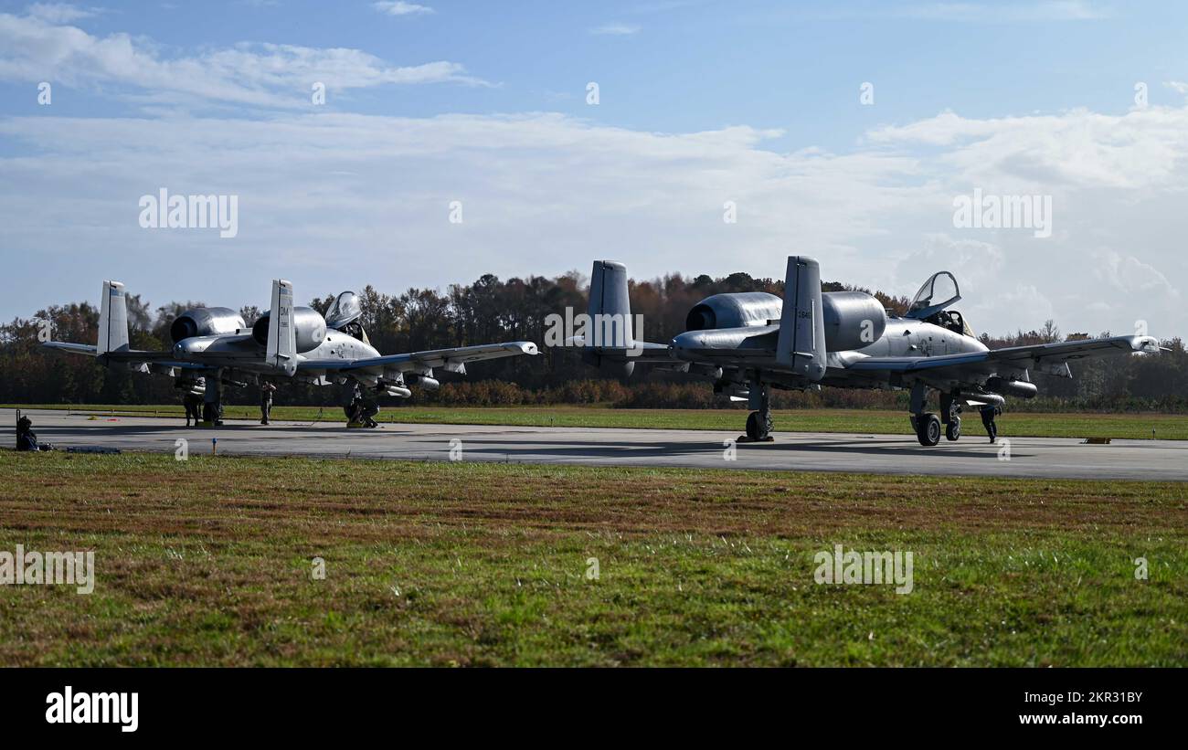 Two A-10 Thunderbolt IIs from the 354th Fighter Squadron at Davis-Monthan Air Force Base sit on the flightline during Bushwhacker 22-07 at Naval Auxiliary Landing Field Fentress, Virginia, Nov. 4, 2022. For this iteration of Bushwhacker, Airmen were spread across multiple locations in Virginia and displayed DM’s ability to accomplish the Lead Wing concept. (U.S. Air Force photo by Airman 1st Class Paige Weldon) Stock Photo