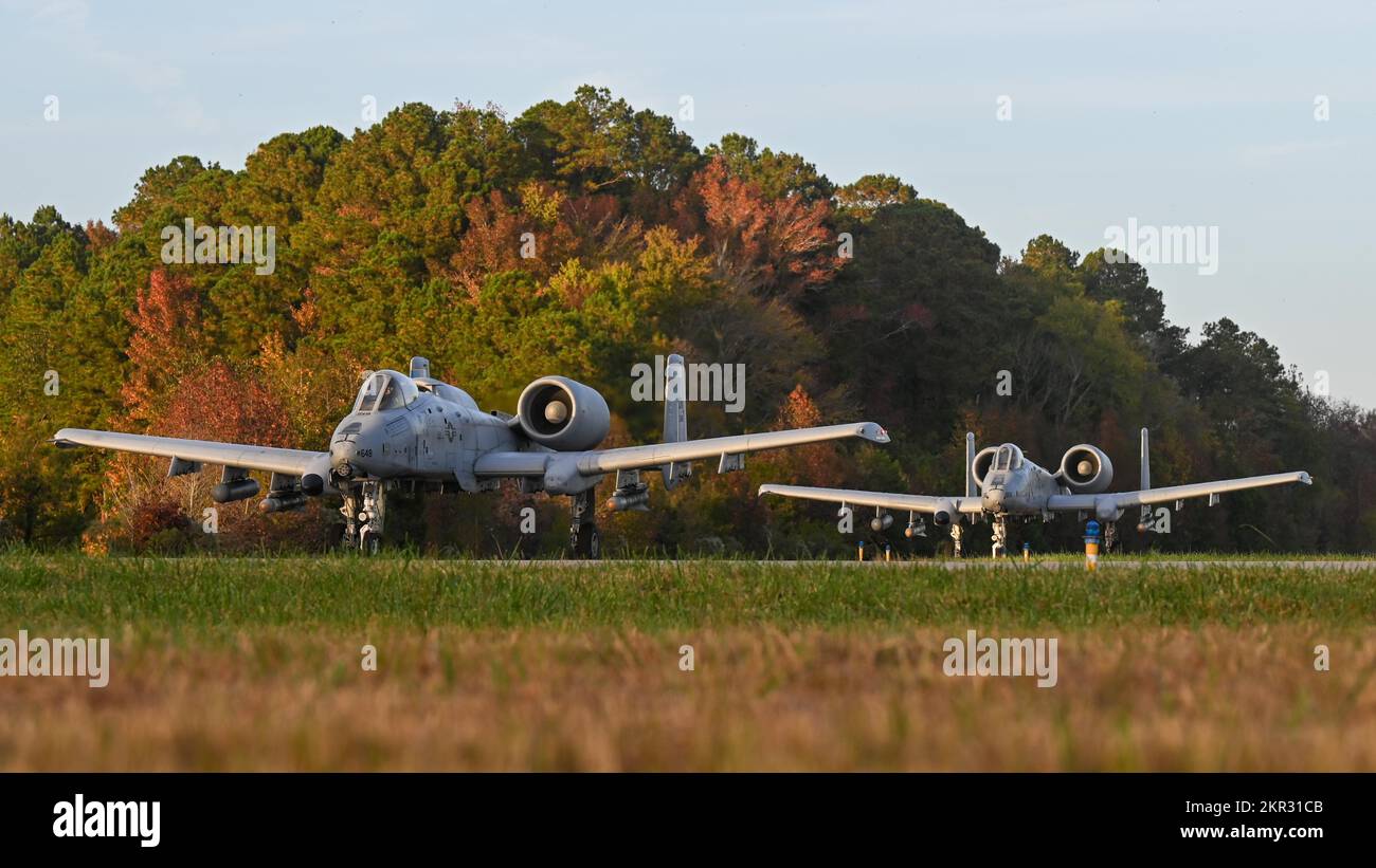 Two A-10 Thunderbolt IIs from the 354th Fighter Squadron at Davis-Monthan Air Force Base taxi down the runway during Bushwhacker 22-07 at Naval Auxiliary Landing Field Fentress, Virginia, Nov. 4, 2022. The 355th Wing trains Multi-Capable Airmen to compete, deter and win the high-end fight, accounting for the ambiguity and uncertainty expected in future conflicts. (U.S. Air Force photo by Airman 1st Class Paige Weldon) Stock Photo