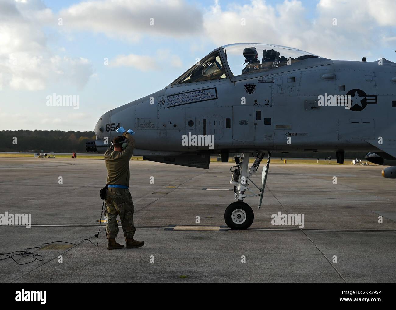 An A-10 Thunderbolt II from the 354th Fighter Squadron at Davis-Monthan Air Force Base is marshaled in at Naval Air Station Oceana, Virginia, during Bushwhacker 22-07, Nov. 3, 2022. This operational training was a part of the Lead Wing certification process and allowed DM to prepare for the final certification exercise projected to take place in 2023. (U.S. Air Force photo by Airman 1st Class Paige Weldon) Stock Photo