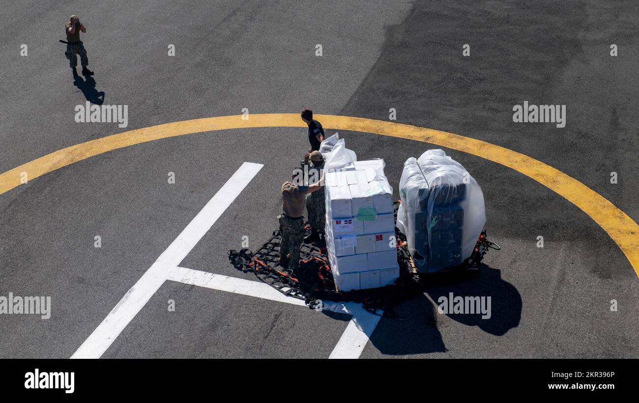 221127-N-DF135-1048 SANTO DOMINGO, Dominican Republic (Nov. 27, 2022) – Sailors assigned to the hospital ship USNS Comfort (T-AH 20), unload cargo for medical sites in Santo Domingo, Dominican Republic on Nov. 27, 2022. Comfort is deployed to U.S. 4th Fleet in support of Continuing Promise 2022, a humanitarian assistance and goodwill mission conducting direct medical care, expeditionary veterinary care, and subject matter expert exchanges with five partner nations in the Caribbean, Central and South America. (U.S. Navy photo by Mass Communication Specialist 3rd Class Deven Fernandez) Stock Photo