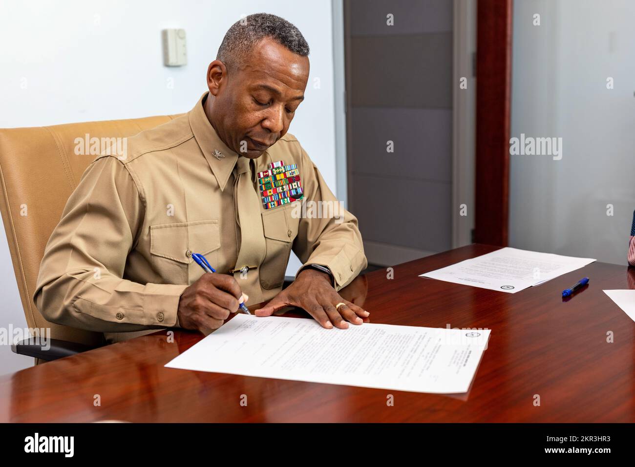 U.S. Marine Corps Col. Michael L. Brooks, base commander of Marine Corps Base Quantico, signs the amendment to the Intergovernmental Support Agreement between Marine Corps Base Quantico and the Board of County Supervisors of Prince William County at the Potomac District Office in Dumfries, Virginia on Nov. 7, 2022. The amendment will increase MCBQ’s spending limits which will allow MCBQ to continue to build on the already successful partnership with Prince William County and ensure MCBQ is able to maintain effective operations and maintenance of the installation. Stock Photo