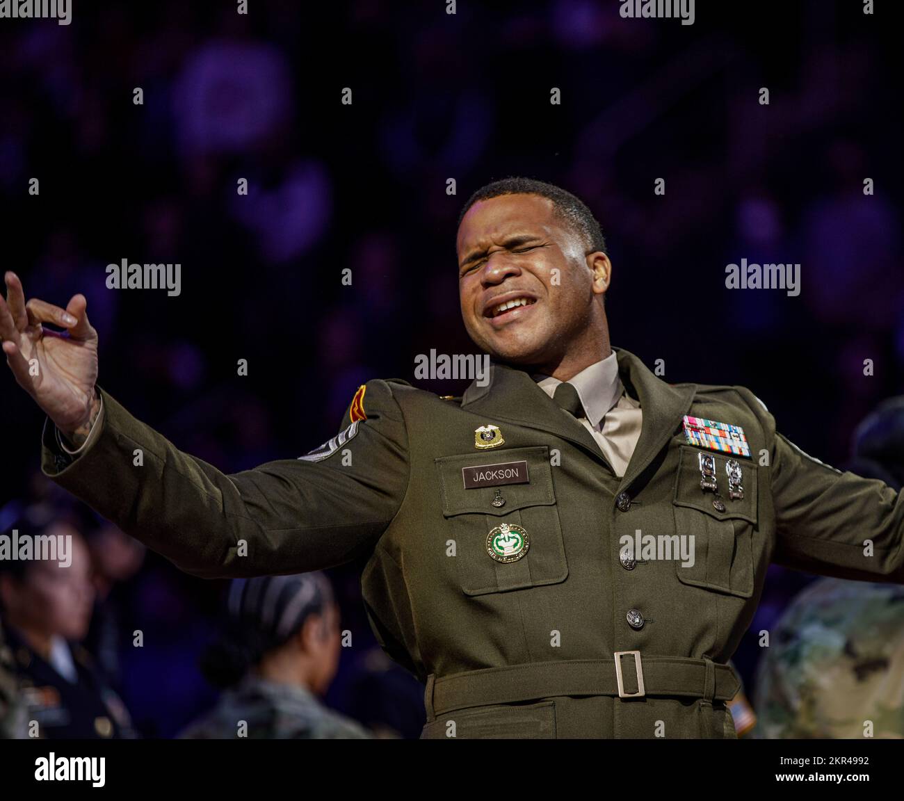 DETROIT, Mich. - 1st Sgt. Christopher Jackson narrates the National Anthem in sign language at the Detroit Pistons Military Appreciation (Hoops for Troops) game Nov. 7, 2022. (Army Reserve photo by Pfc. Joseph Honce, 220th Public Affairs Detachment).     The Detroit Pistons honor the service of our veterans at the Military Appreciation (Hoops for Troops) game in honor of Veterans Day. Veterans Day is a way to say thank you to all those who have served with the highest appreciation. Those who have risked their lives making sacrifices for their country and families. The expression of gratitude a Stock Photo