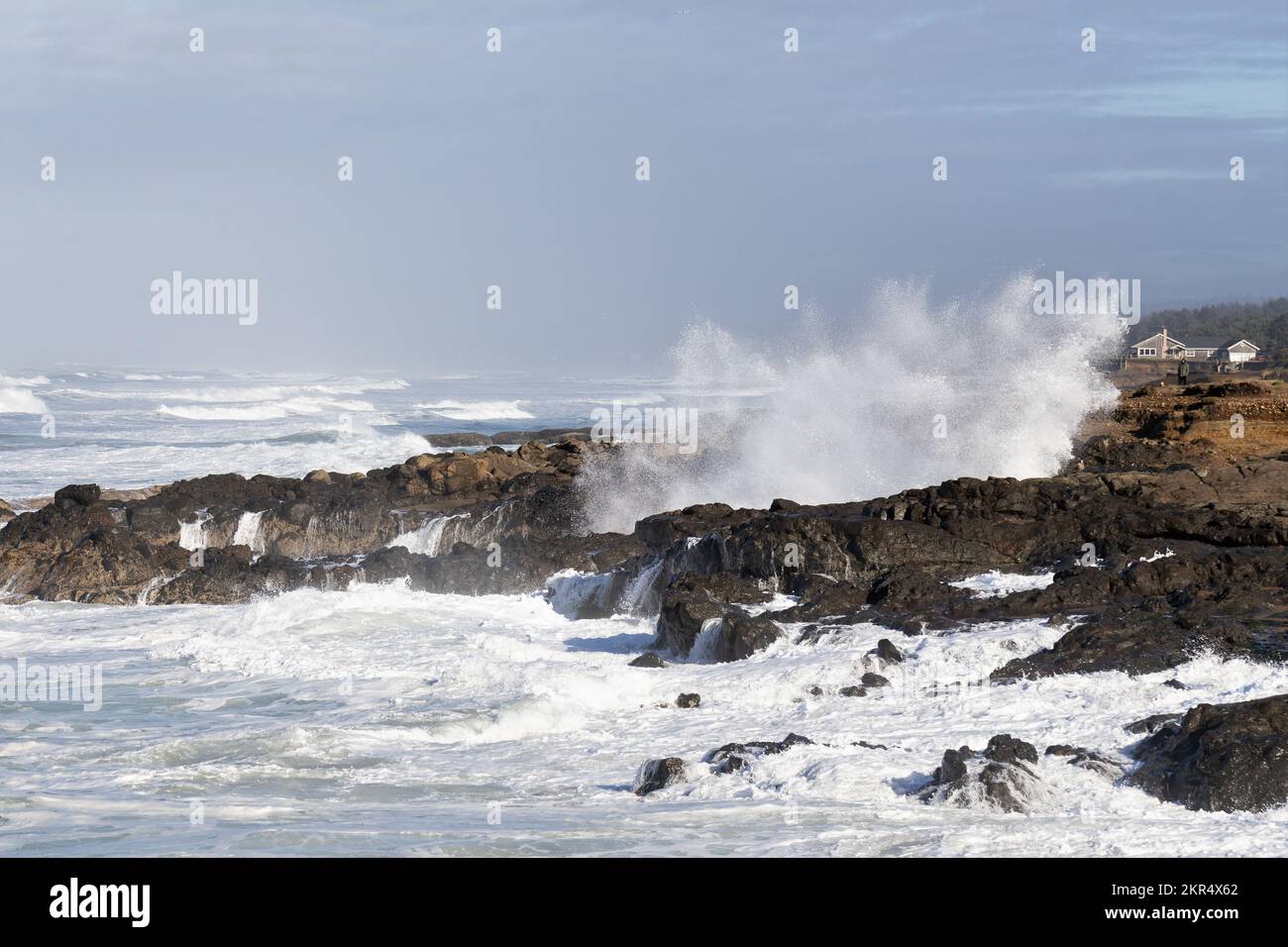 Huge waves crashing against the rocky shoreline during a king tide in Yachats, Oregon. Stock Photo