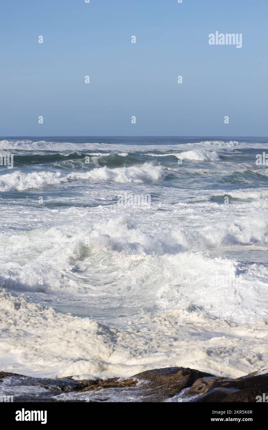 The turbulent surface of the Pacific Ocean during a king tide - an extremely high tide - in Yachats, Oregon. Stock Photo