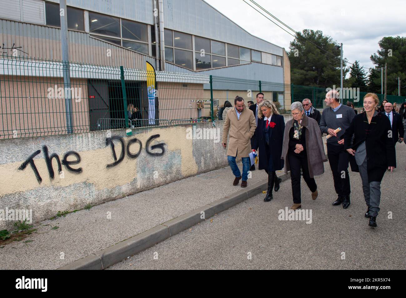 A group of visitors with Charlotte Caubel (R) and Genevieve Darrieussecq (center with coat on the shoulders) walk to the gymnasium for inauguration. Genevieve Darrieussecq (Minister for the People with Disabilities) and Charlotte Caubel (Secretary of State for Children) inaugurated the Leo Lagrange Medico Educational Institute (IME) in La Seyne-sur-Mer (Var). This is an innovative structure because it is located directly in a mainstream school, allowing for a mix between the fifty or so disabled children aged between 4 and 12 years old and all the other pupils. (Photo by Laurent Coust/SOPA I Stock Photo