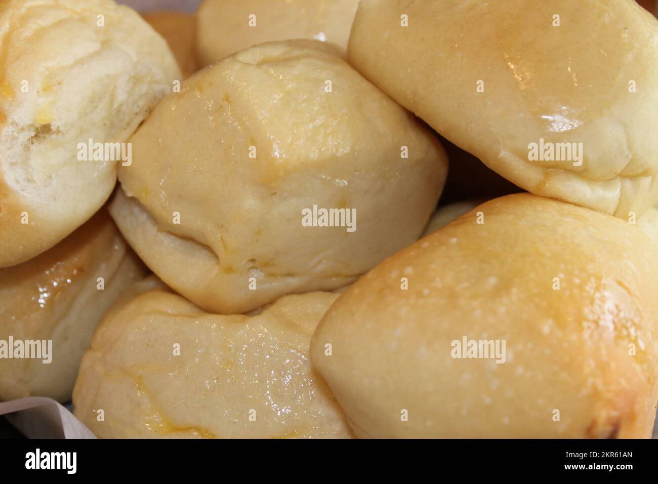 Big batch of baked biscuits in a basket Stock Photo
