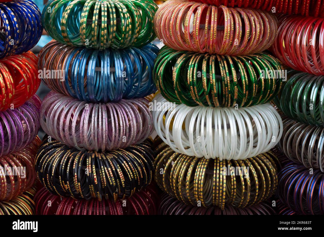 Colorful Rajasthani bangles being sold at famous Sardar Market and Ghanta ghar Clock tower in Jodhpur, Rajasthan, India. Stock Photo