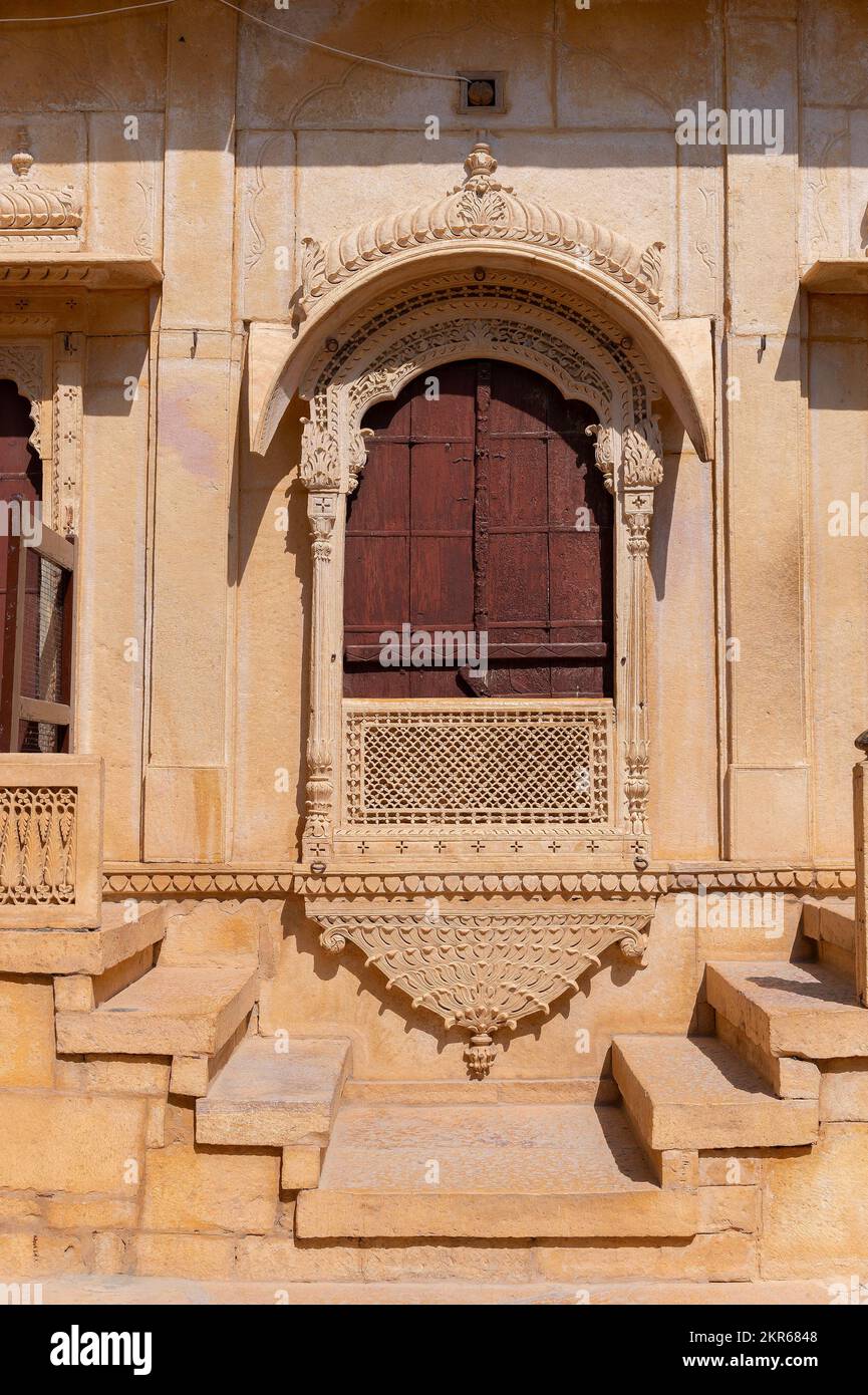 Sandstone made beautiful balcony, jharokha, stone window and exterior of Rani Mahal or Rani Ka Mahal, inside Jaisalmer fort. Rajasthan, India. UNESCO Stock Photo