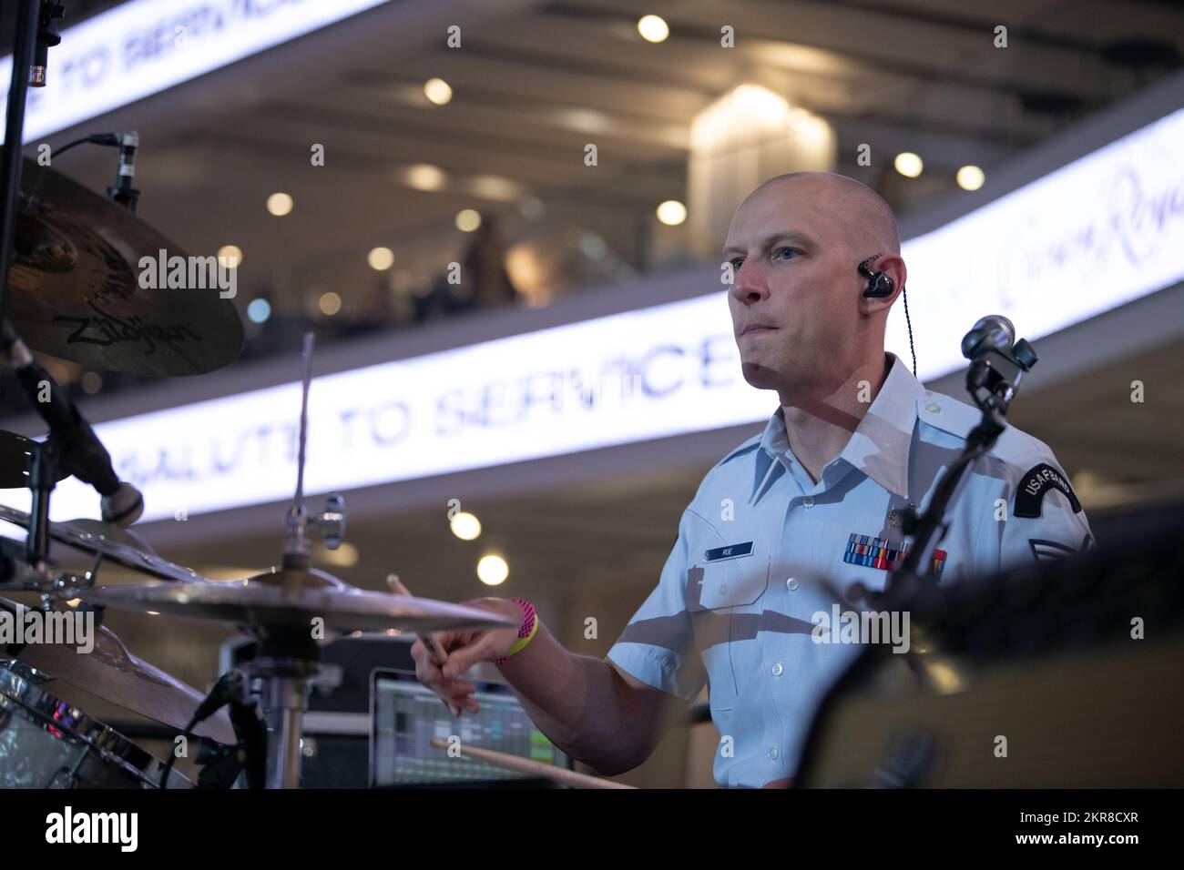 U.S. Air Force Staff Sgt. Mike Roe, USAF Band of the Golden West drummer, performs during a Sacramento Kings basketball game at the Golden 1 Center, Sacramento, California, Nov. 9, 2022. The performance was part of the Kings’ “Salute to Service” night that honored Veterans Day and paid respect to all Veterans in attendance. Stock Photo