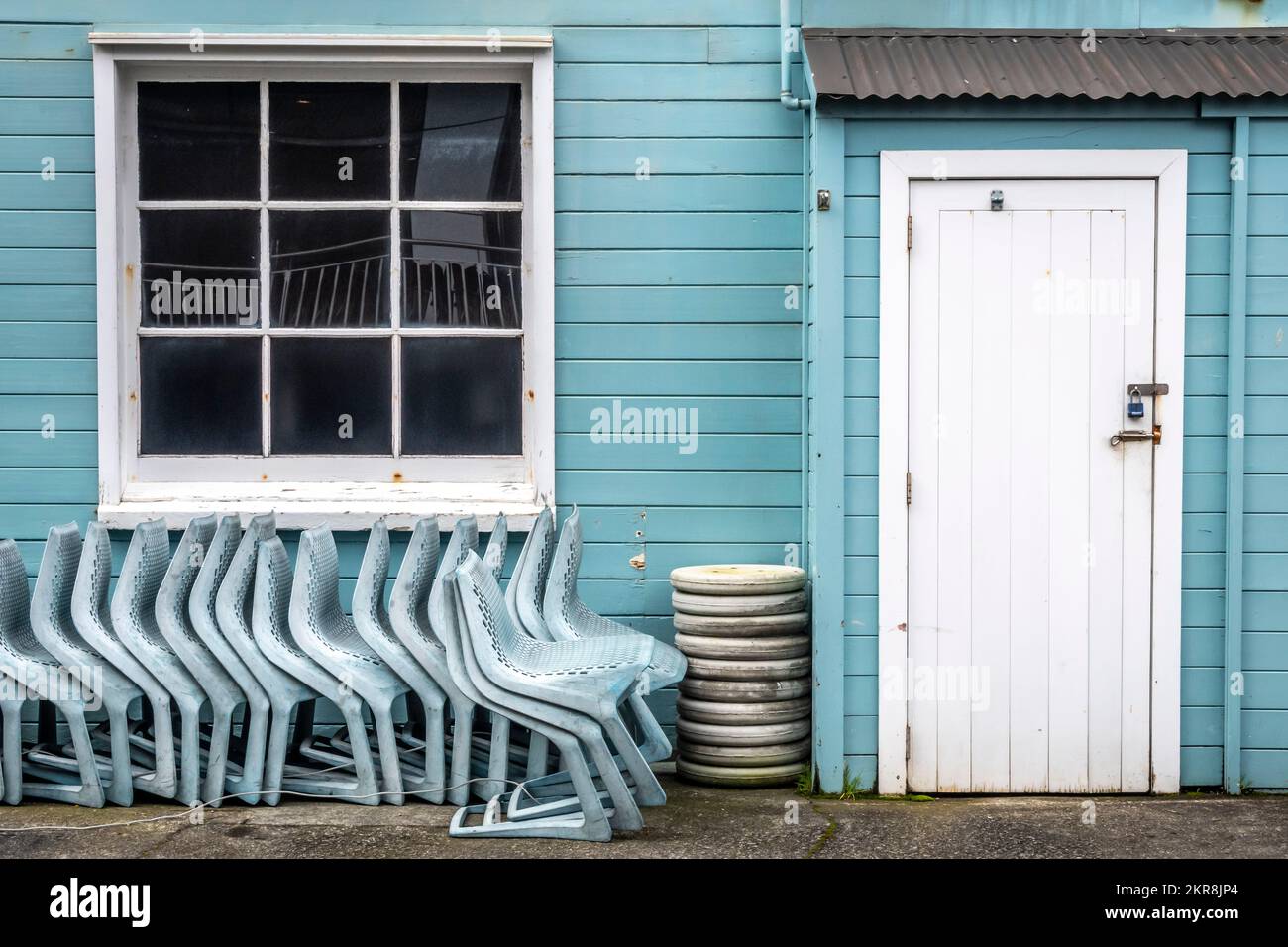 Chairs stored at rear of building, Wellington, North island, New