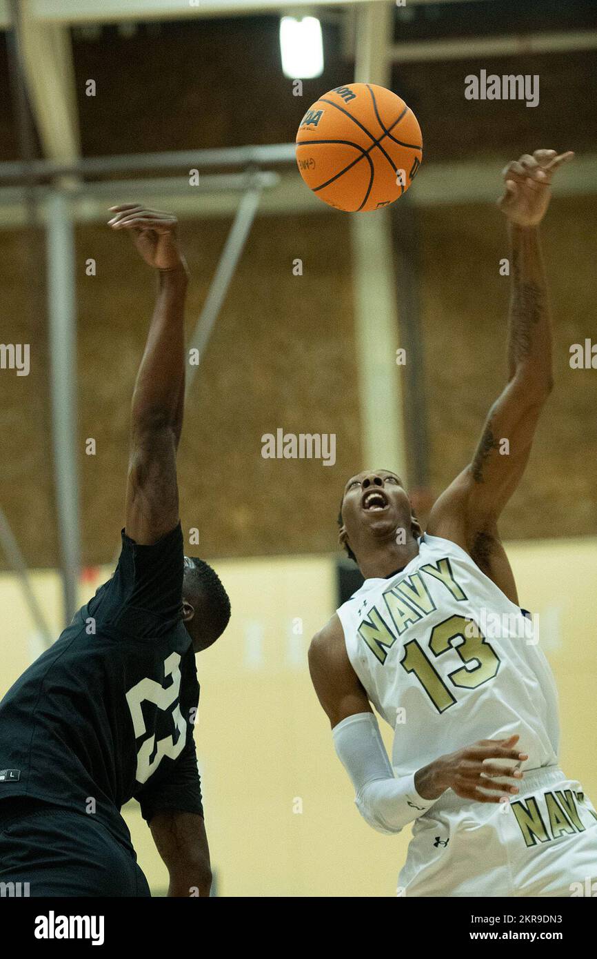 Navy Petty Officer 3rd Class Ramel Bethea, right, battles for a rebound ...