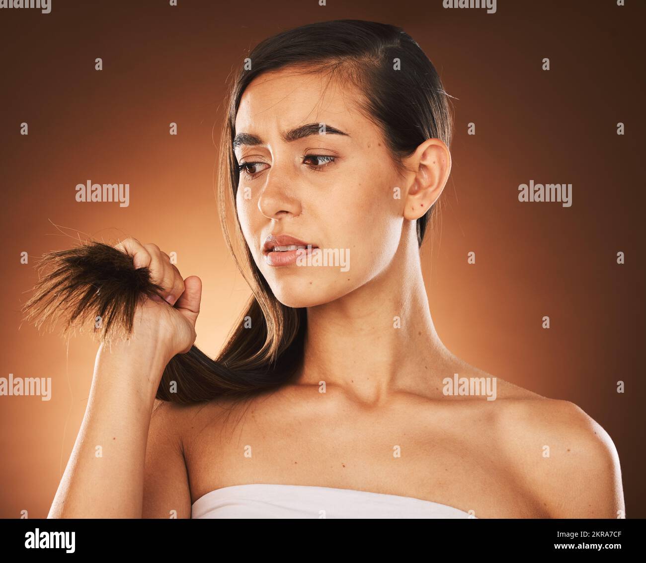 Hair, keratin and treatment with a model woman in studio on a brown