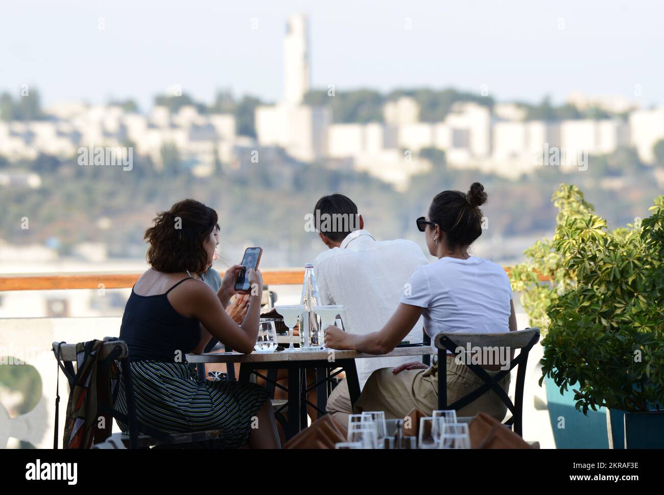 Tourist enjoying the city views from the Wine & Cheese rooftop