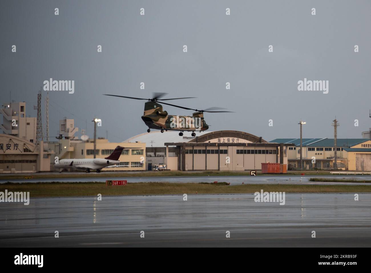 U.S. Marines with 12th Marines, 3d Marine Division, take off in a Japan Self-Defense Force CH-47JA helicopter in support of Keen Sword 23, on Okinawa, Japan, Nov 11, 2022. U.S. Marines flew to Yonaguni, Japan to participate in Bilateral Ground Tactical Coordination Center operations in support of Keen Sword 23. Keen Sword is a biennial training event that exercises the combined capabilities and lethality developed between 3d Marine Division, III Marine Expeditionary Force, and the Japan Self-Defense Force. This bilateral field-training exercise between the U.S. military and JSDF strengthens in Stock Photo