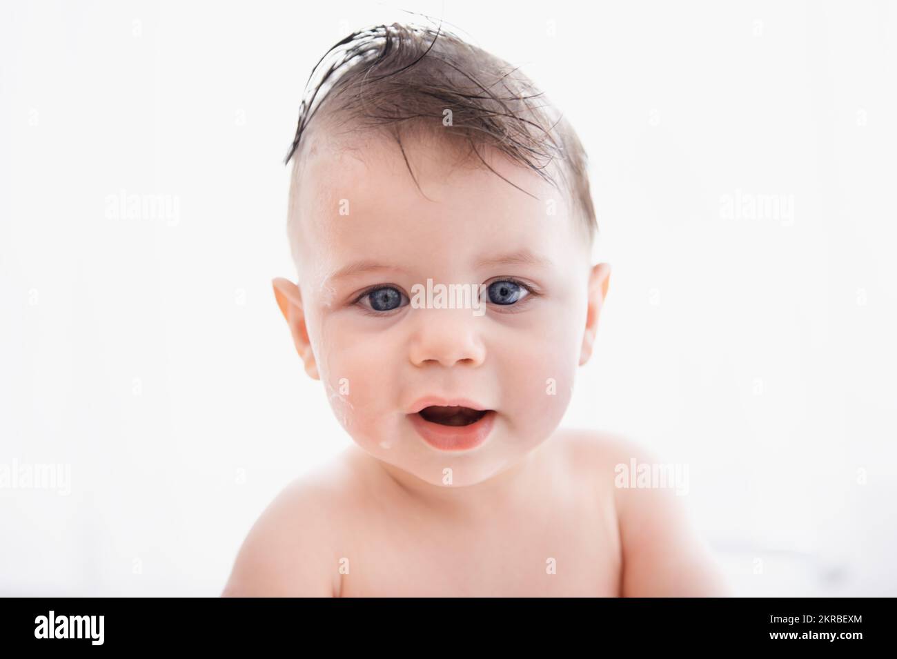 Clean little man. Portrait of a cute baby boy sitting in a bathtub